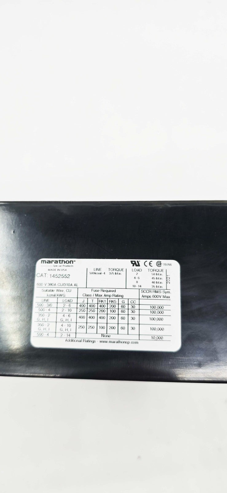 Marathon 1452552 power distribution block, 600V 380A, four-position rocker switch, panel mount, label on black panel.